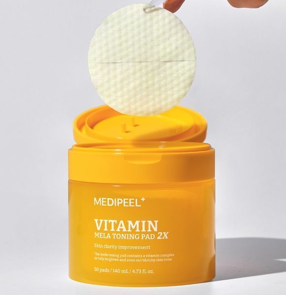 Тонізуючі вітамінні педи для обличчя MEDIPEEL Vitamin Mela Toning Pad 2X 50 шт. 2868337133 фото